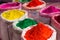 Colorful gulal powder in gunny bags ready for sale on hindu indian festival of holi