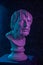 Colorful gypsum copy of ancient statue of Lucius Seneca head for artists on a dark textured background. Seneca 4 BC-65