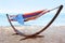 Colorful hammock with blanket at seaside