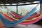 Colorful hammocks hanging under the roof in tropical paradise