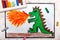 Colorful hand drawing: dragon spitting fire.