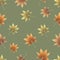 Colorful hand drawn autumn leaves of maple on calm green background. Seamless seasonal pattern.