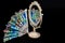 Colorful Hand Fan reflects in Vintage Oval Desk Mirror with white frame