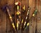 Colorful hand made decorated magic wands on witch table, top view