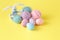 Colorful handmade easter eggs with wool clew and toy rabbit