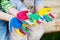 Colorful hands of children playing outside