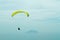 Colorful hang glider in sky