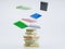 Colorful hardcover books flying on white background, Stack of books in colour covers