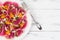 Colorful and healthy watermelon radish, orange and goat cheese carpaccio salad. Top view, free text copy space