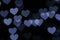 Colorful heart-shaped on black background lighting bokeh for decoration at night backdrop wallpaper blurred valentine Love