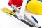 Colorful helmets and tools for construction drawings and buildings