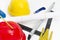 Colorful helmets and tools for construction drawings and buildings