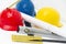 Colorful helmets and tools for construction drawings and buildings