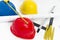 Colorful helmets and tools for construction drawings and buildings