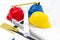 Colorful helmets and tools for construction drawings and buildings