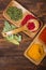 Colorful herbs,spices and aromatic ingredients on wooden table.