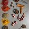 Colorful herbs and spices for cooking dishes. Indian and Asian spices On grey stone background closeup