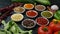 Colorful herbs and spices for cooking. Indian spices. On a black background. Top view