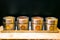 Colorful herbs and spices in metal and glass jars. Natural colors and top view. Health India spices