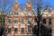 Colorful heritage buildings with gable rooftops, located along Singel Canal in Amsterdam