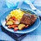 Colorful homecooked steak dinner with vegetables