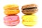 Colorful homemade macaroons on white background.