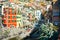 The colorful homes stacked tightly above the boat launch of the village of Riomaggiore, Italy, one of the Cinque Terre Villages