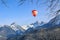 A colorful hot air balloon flying and floating over the Swiss Alps