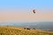 Colorful hot air balloon flying over an autumn landscape