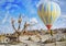 Colorful hot air balloon flying over the valley at Cappadocia