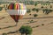 Colorful hot air balloon landing