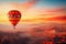 Colorful hot air balloon over desert mountains at sunset