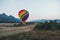 Colorful hot-air balloon raising just in time to explore beautiful sunset over Vang Vieng in Laos, Southeast Asia