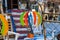 A colorful hot air balloon shaped wind spinner hanging in an antique store surrounded by various antiques in Douglasville