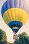 Colorful of hot air balloon takes off over the trees