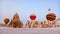 Colorful hot air balloons begining to fly at sunrise in Cappadocia