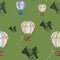 Colorful hot air balloons flying across green mountains on green background. Seamless pattern. Stationery, transport, travel, kids