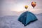 Colorful hot air balloons flying on blue tent camping on hill