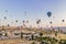 Colorful hot air balloons flying over at fairy chimneys valley in Nevsehir, Goreme, Cappadocia Turkey. Spectacular