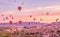 Colorful hot air balloons flying over rock landscape at Cappadocia Turkey