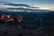 Colorful hot air balloons glowing in early morning dawn while filling up with hot air. Mountain landscape in Cappadocia