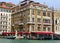 Colorful Hotel and Gondolas Along the Grand Canal