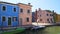 Colorful houses and canal in Burano, beautiful architecture in Venice, panorama