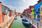 Colorful houses and canal on Burano island, near Venice, Italy.