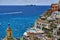 Colorful houses and church on coastline of Positano town in Italy