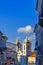 Colorful houses facades and historic church towers in baroque and colonial style with blue sky