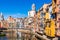 Colorful houses, Onyar river and Saint Mary Cathedral at background in Girona, Spain