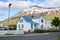 Colorful houses in small town Seydisfjordur on East Iceland in summer with lake and snow