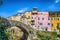 Colorful houses in a small village with stone bridge at Dolcedo, Imperia, Liguria, Italy