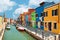 Colorful houses by the water canal at the island Burano near venice, Italy